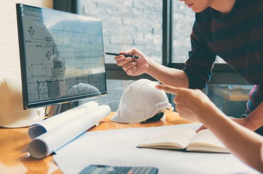 dessinateur en bâtiment et un architecte